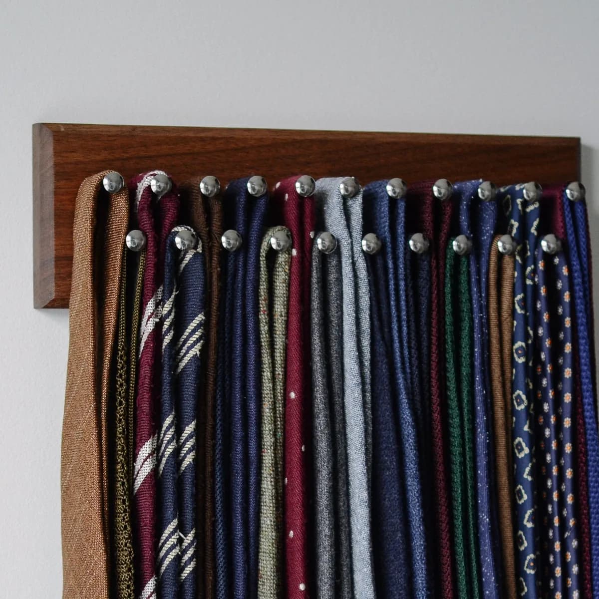 Dapper Woodworks 12-inch handcrafted walnut tie rack with metal pegs