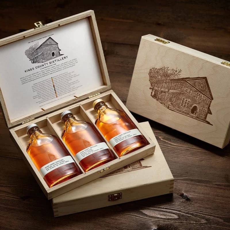 Kings County Distillery Signature Gift Set — three 200ml bottles of Brooklyn-made straight bourbon, peated bourbon, and Empire Rye