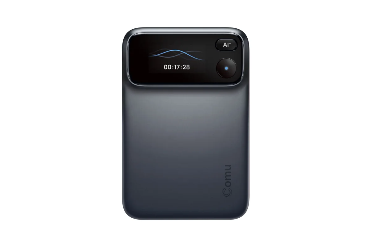 Dark grey Comu Action Pro AI recorder with a small screen showing a recording timer