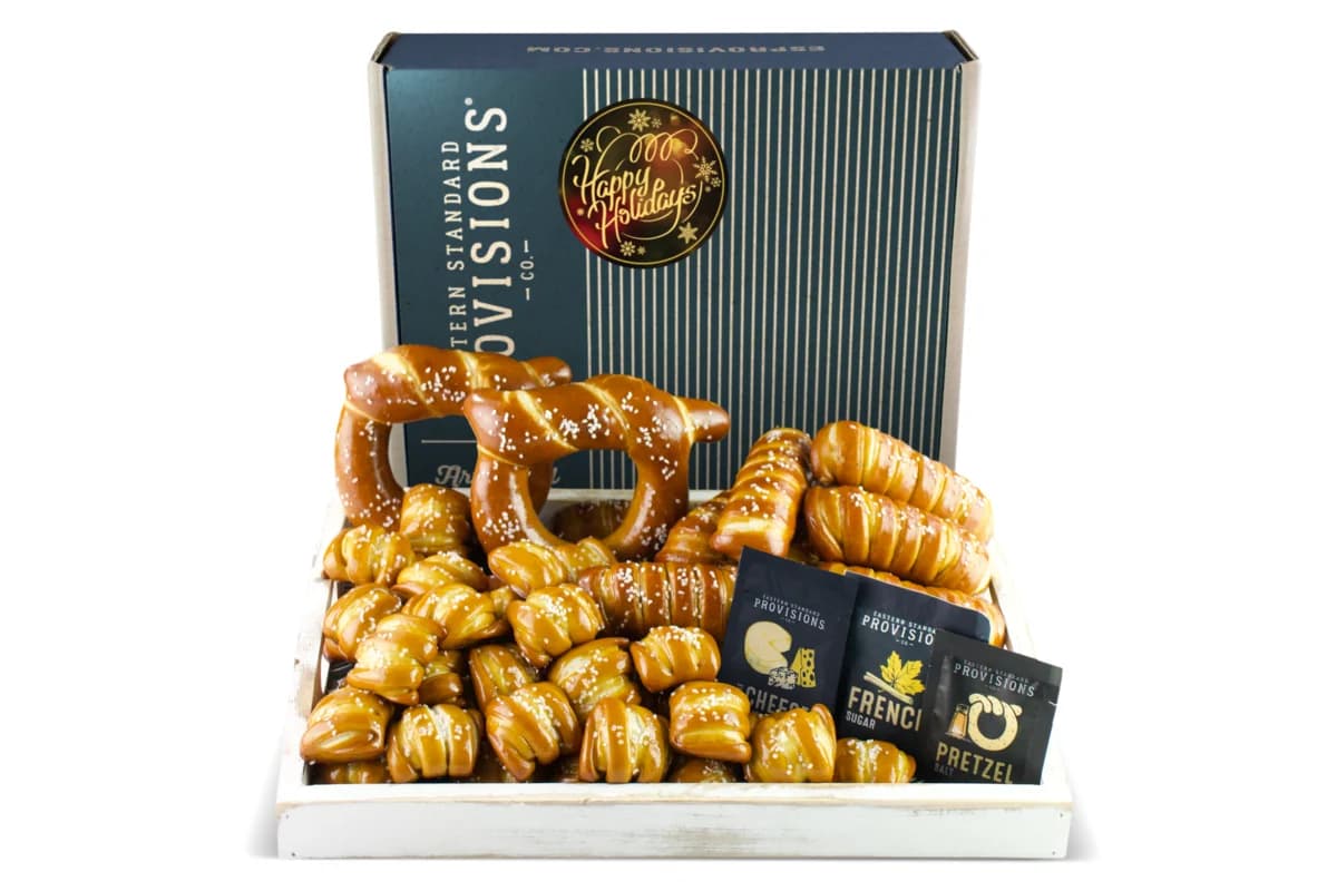 Open Eastern Standard Provisions Happy Holidays box with soft pretzels, sticks, bites and salt packets