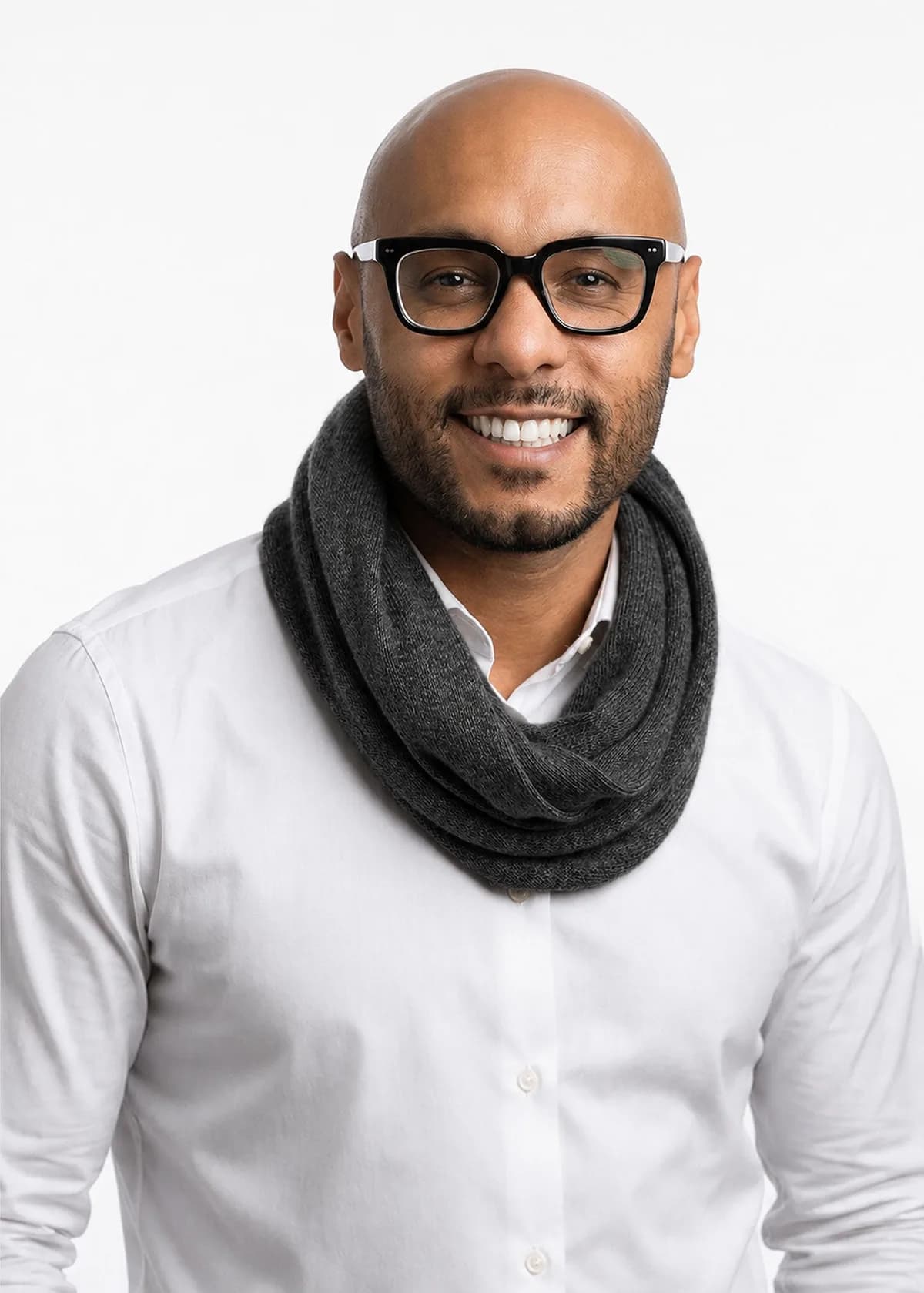 Man wearing the EcoPersona black baby alpaca circular scarf over a white shirt