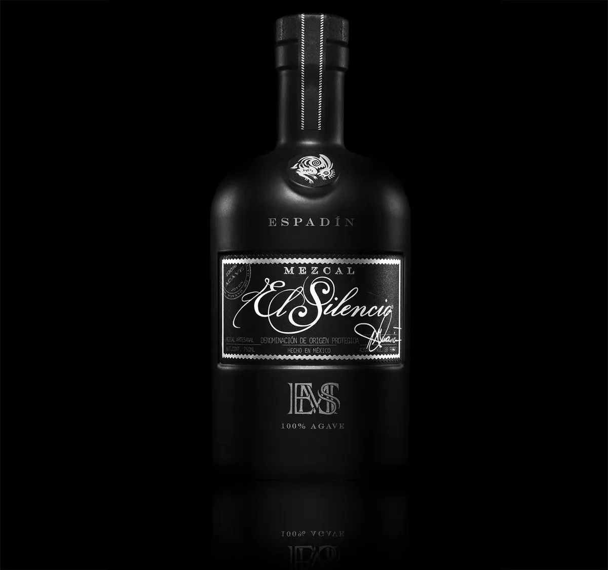 Black El Silencio Mezcal Espadín bottle on a black background