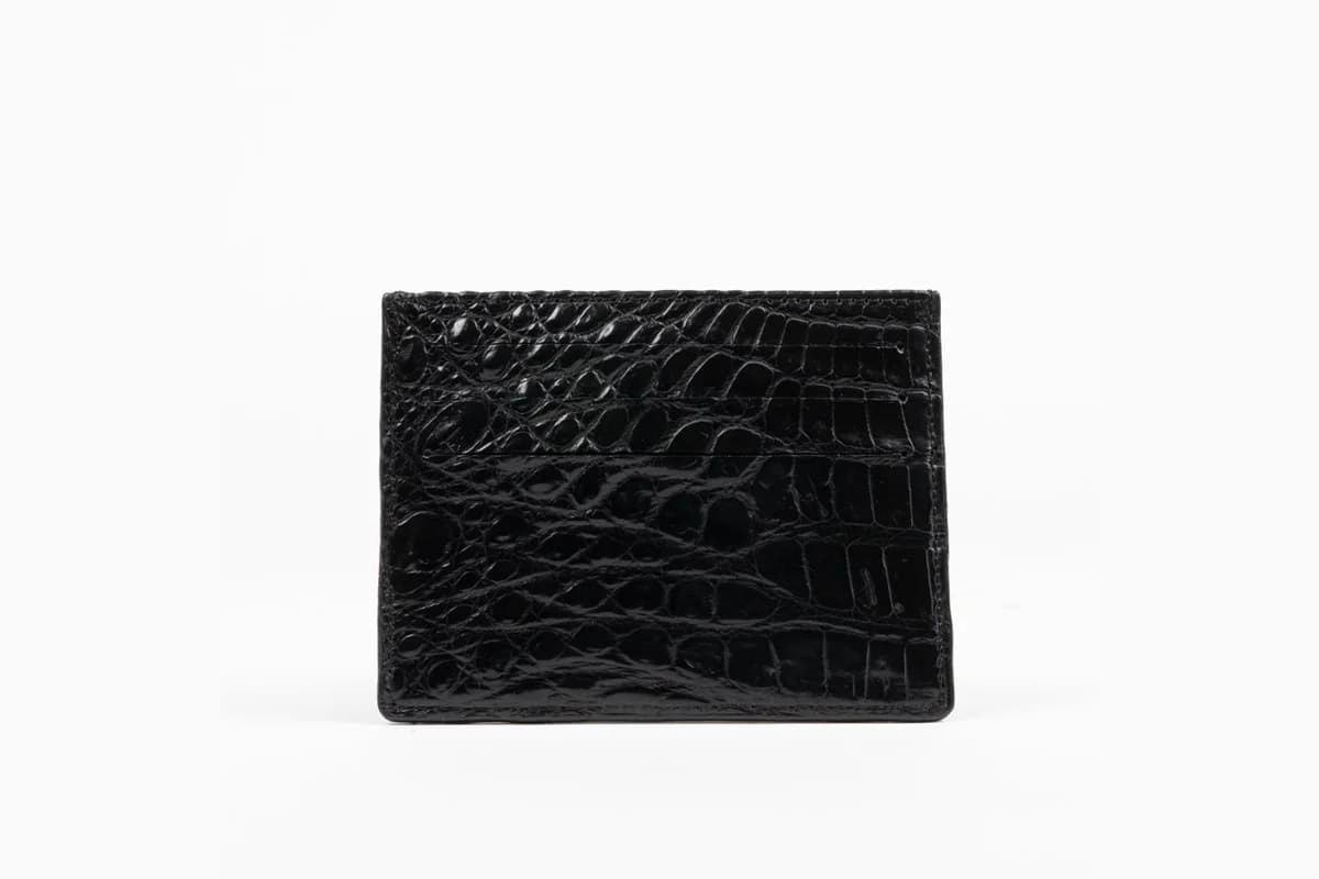 Black crocodile skin credit card case from Sherrill Brothers on a white background